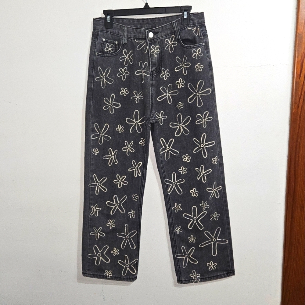 Black High Rise Wide Leg Painted Daisy Jeans. Not stretchy at all. 29" Waist.